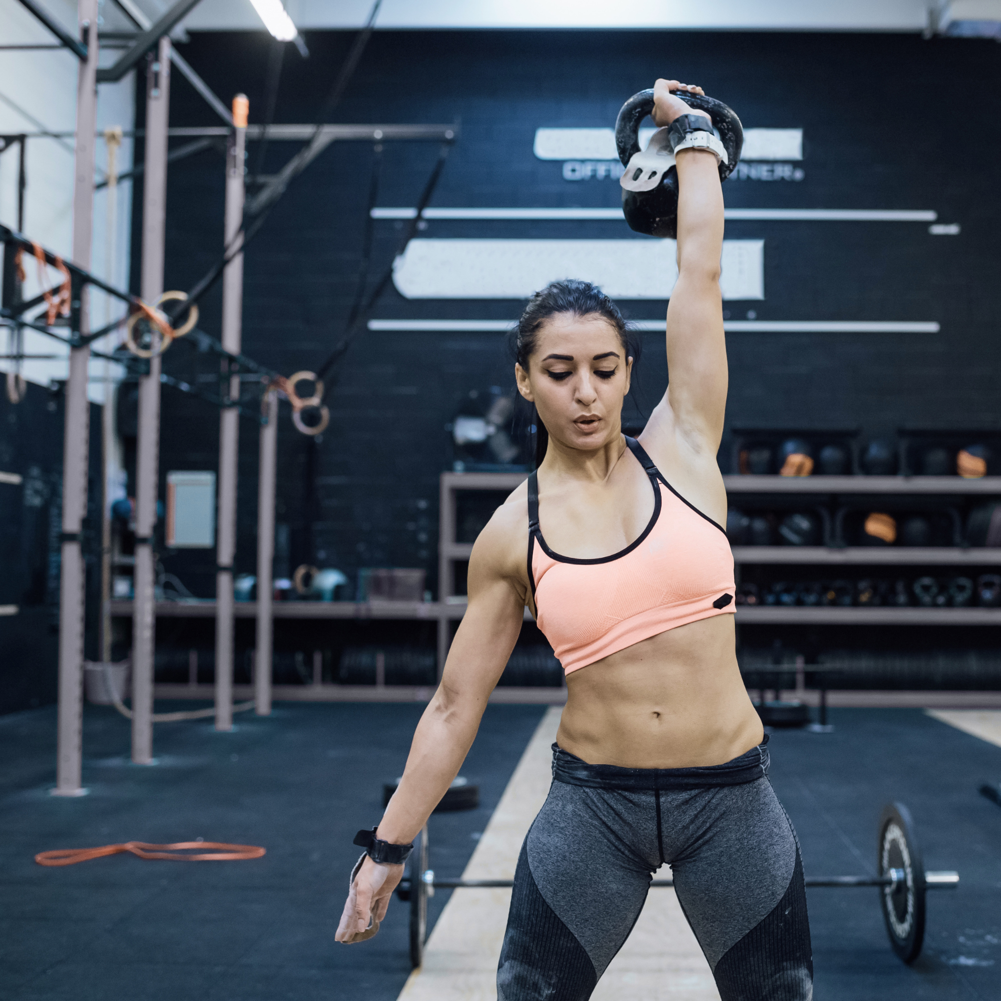 Functional athlete training with a kettlebell and wearable