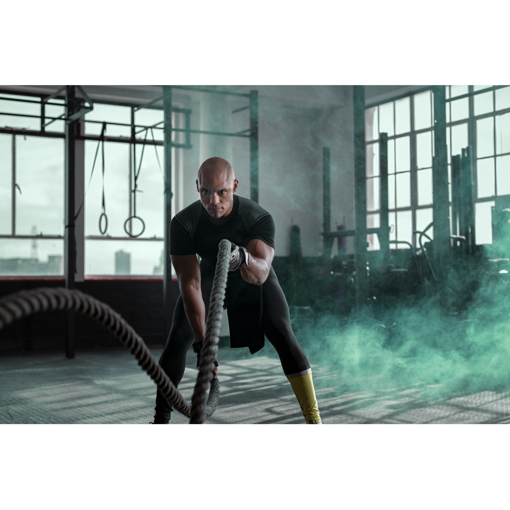 Functional Hybrid athlete training with battle ropes